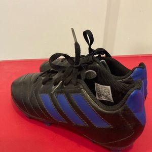 Little boys size 12.5 adidas cleats. Black with blue stripes.